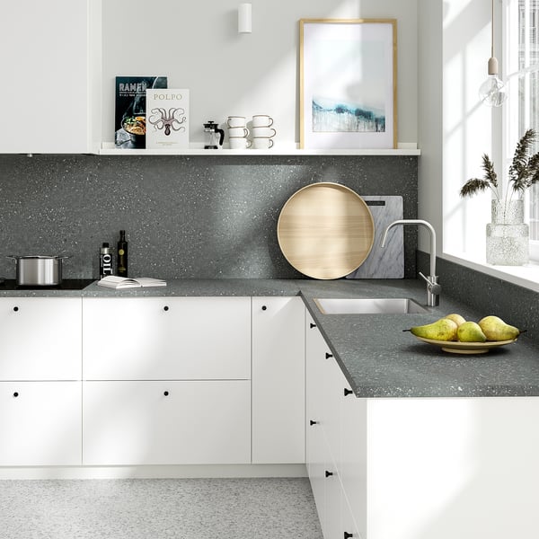 Grey SIBBARP wall panel with speckled design, kitchen items.