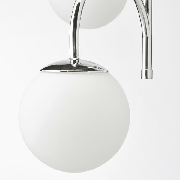 Sleek glass chrome lamp, elegant simplicity, diffuse lighting.