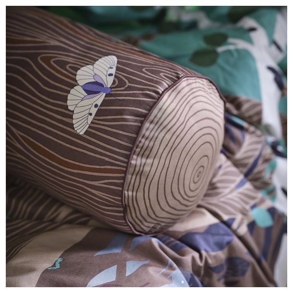 Cosy cylinder-shaped cushion with wood-like print, featuring a decorative butterfly, designed for childrens comfort.
