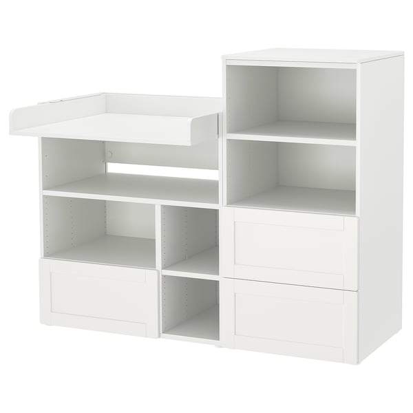A white ikea SMÅSTAD modular storage unit for a childs room, featuring multiple shelves and drawers for versatile storage.