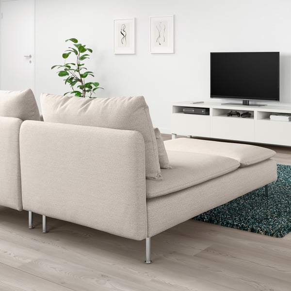 Modern living room with beige SÖDERHAMN sectional sofa and chaise. Includes tv, art, plant, and blue rug.
