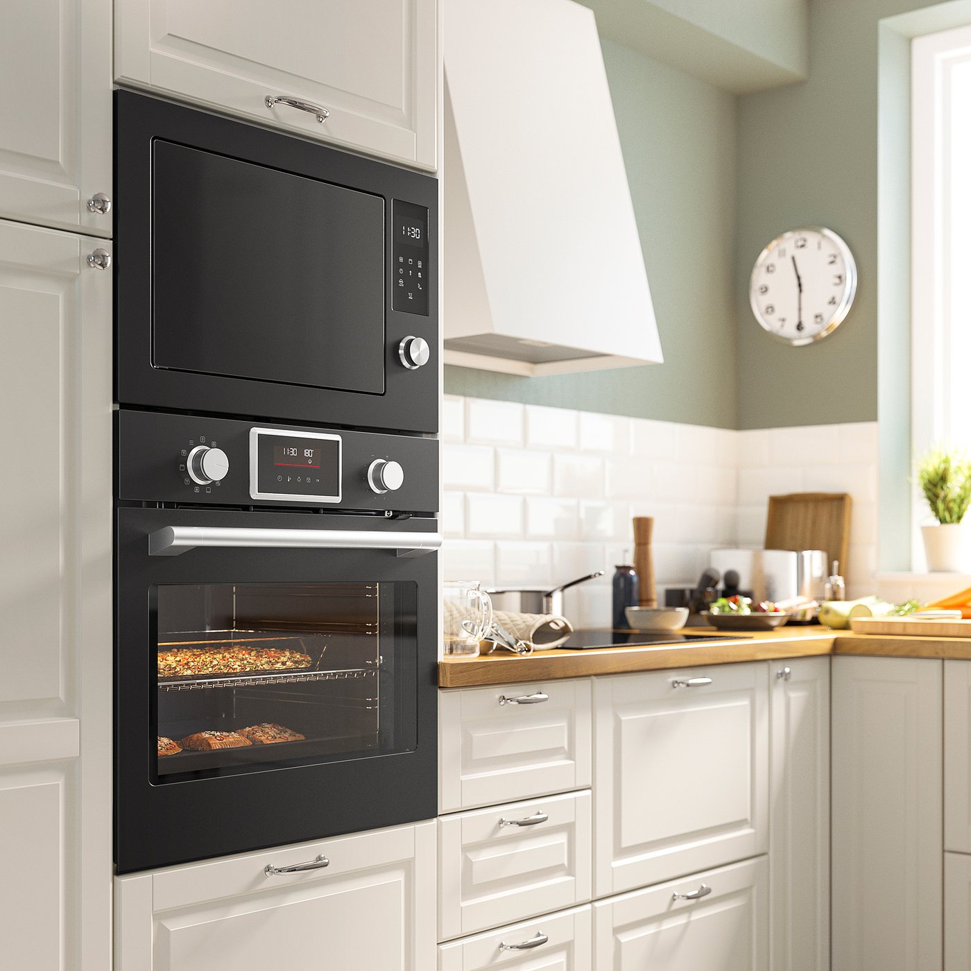 Modern kitchen with black IKEA STENABY oven between white cabinets, efficient & sleek.