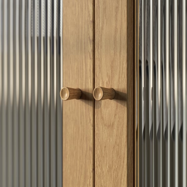 Wooden door with two light brown oval knobs, simple and timeless design.