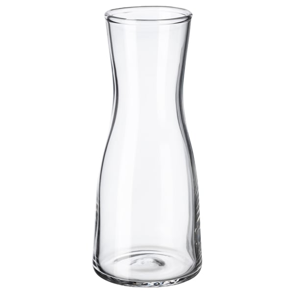 Clear glass vase with a curved design. Simple, elegant shape suitable for small floral arrangements.