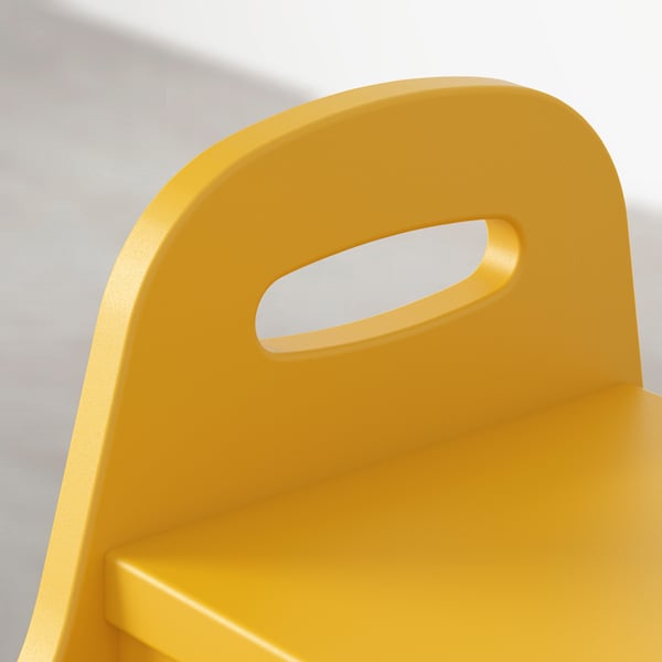 Yellow step stool with ergonomic handles, stable on flat surface.