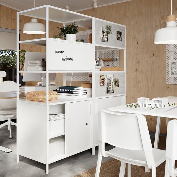 Modern workspace TROTTEN white cabinet with open shelves, drawers, and a computer setup, perfect for a minimalist home office.