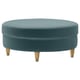 A blue IKEA VALNÄS velvet ottoman with a round shape. It has wooden legs with gold caps and a simple, modern design.