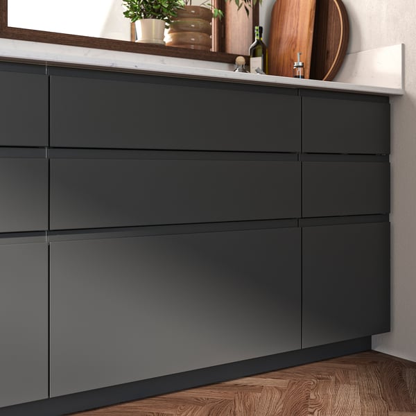 Dark grey modern kitchen cabinets, sleek and minimalist with matt finish and clean lines.