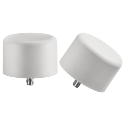 Два белых круглых навершия: один вертикальный, другой наклоненный, с винтами внизу. Минималистичный дизайн из переработанного пластика.