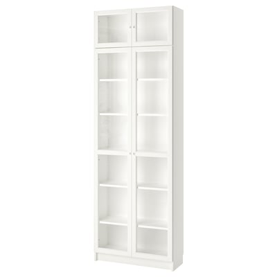 A white BILLY bookcase with glass doors, featuring adjustable shelves and a modern design.