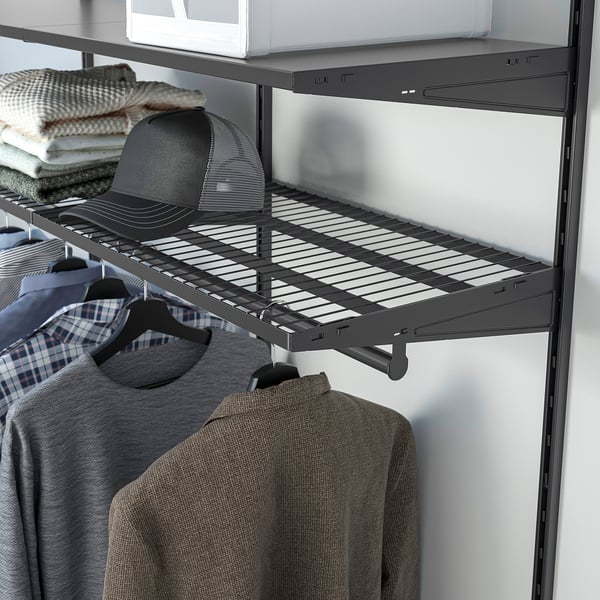 A BOAXEL wall-mounted storage system with shelves and a hanging rod for clothes and accessories.