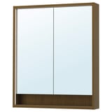 The FAXÄLVEN mirror cabinet is oak-colored with integrated lighting and a wooden frame. It has a rectangular shape, a large mirror, and a shelf below.