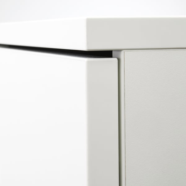 Close-up of a sleek, white GALANT storage unit showing clean lines, adjustable shelves, and a smooth finish, emphasising robust design and quality.