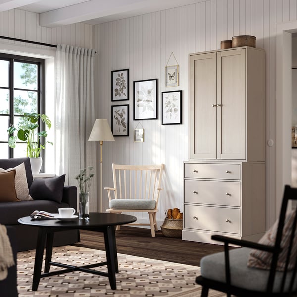 Cosy living room with grey wall, HAVSTA furniture in light beige, natural light, and minimalist decor.