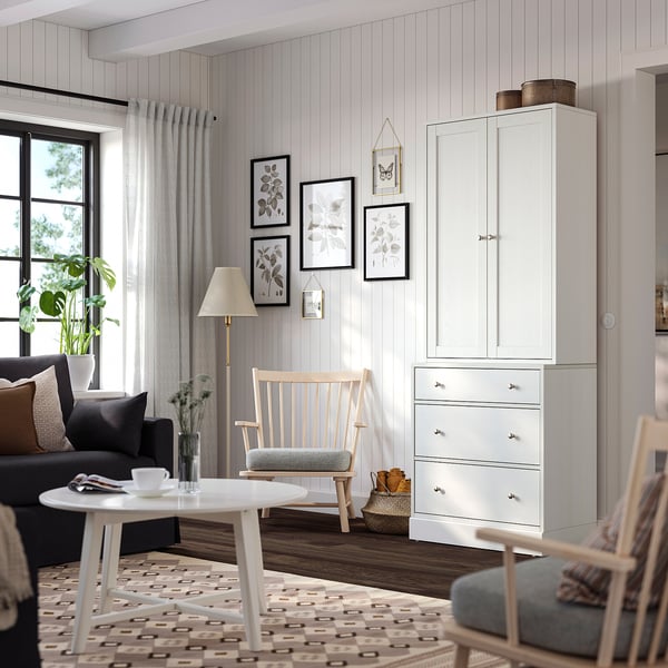 Living room with HAVSTA cabinet, sofa, & floral art