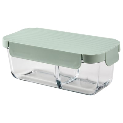 A HAVSTOBIS glass lunch box with a green lid and divider. Its rectangular and designed for storing food separately.