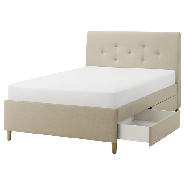 IDANÄS beige upholstered bed with buttoned headboard and storage drawers.