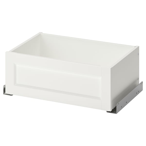 A white KOMPLEMENT drawer with a modern design for pax wardrobe, featuring a sleek frame and partially open front.