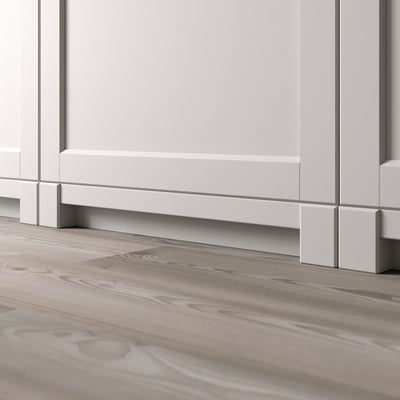 White LERHYTTAN kitchen leg fits metod series, showing part of light grey kitchen base.