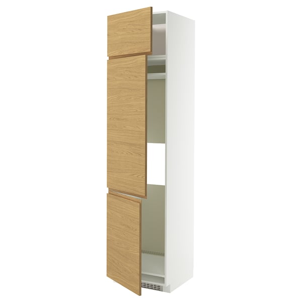 A white METOD kitchen cabinet with oak-look wood doors and minimalist design.