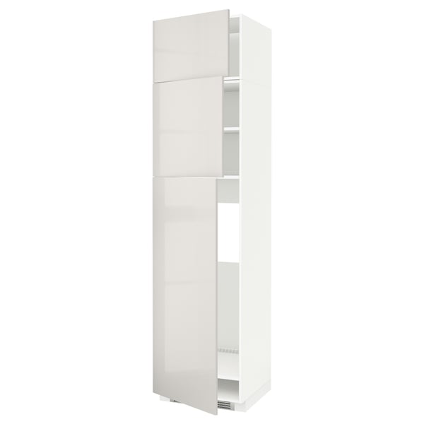 A white METOD tall kitchen cabinet with sleek, high-gloss doors and an open shelf, designed for modern kitchens.