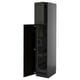 Tall black kitchen cabinet with one open door, metallic hinges, and inner shelves.