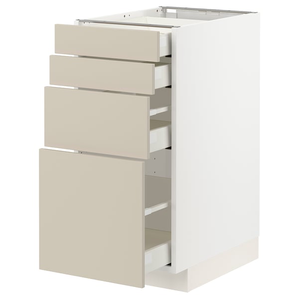 White METOD kitchen unit with beige drawers, smooth and modern design.