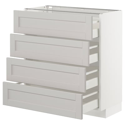 White METOD kitchen unit with bevelled grey drawers.