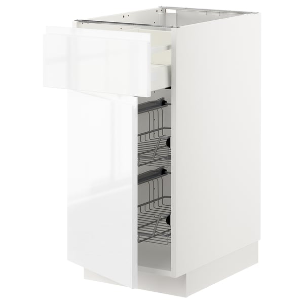 A white METOD kitchen cabinet with a smooth finish and integrated handles, featuring multiple wire baskets for organised storage.