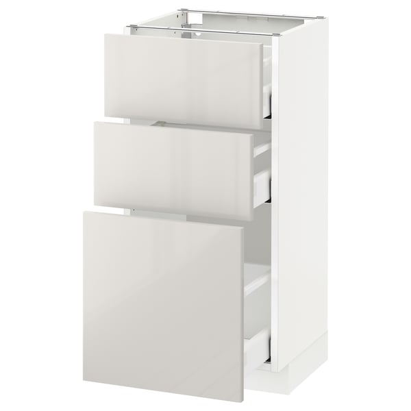 METOD white kitchen cabinet with 3 drawers, high-gloss finish.