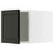 Modern black kitchen cabinet with sleek design.