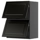 Black kitchen cabinet set with bevelled edges and 2 open drawers.