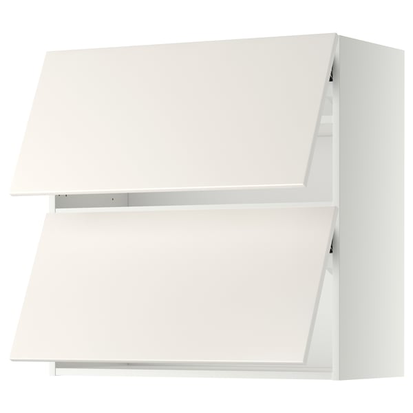 A white METOD kitchen cabinet with smooth surfaces. Its rectangular, featuring two closed sections and is part of the veddinge series.