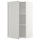 A white METOD kitchen cabinet with adjustable shelves and beveled edges.