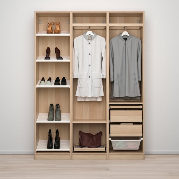Organised closet with hanging clothes, shelves for shoes, and drawers.
