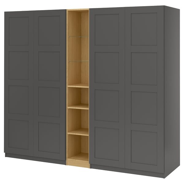 An IKEA PAX wardrobe in dark grey with a wooden interior. It has multiple compartments and sleek design.