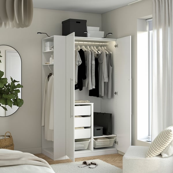 Modern wardrobe with hanging clothes, adjustable lighting, and shelves, organised for storage and easy access.