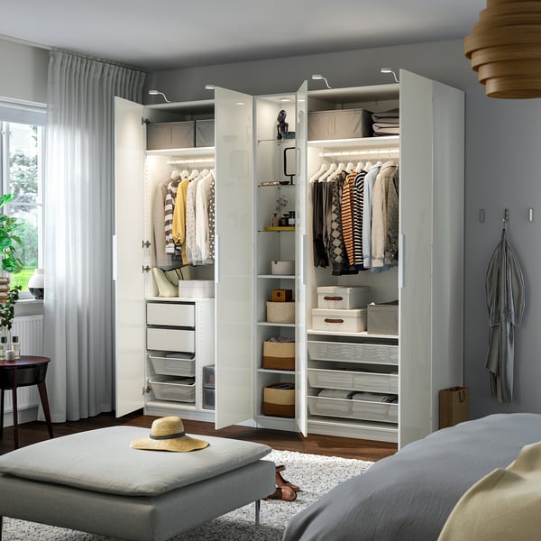 Large wardrobe with shelves, drawers, hanging space, and built-in lighting.
