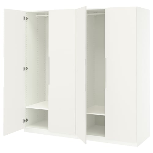 White PAX wardrobe, awaits setup. Open sections, hinges, shelves. Modern, simple design.