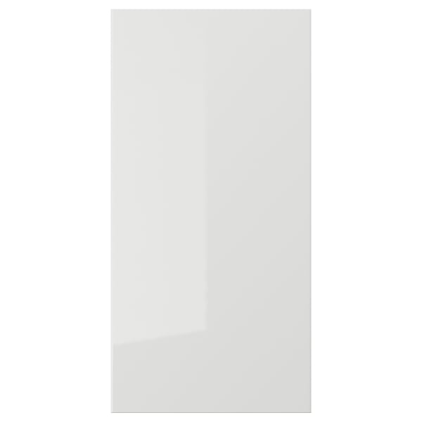A sleek, white RINGHULT kitchen cabinet door with a glossy finish. Its rectangular, modern, and designed for easy cleaning.