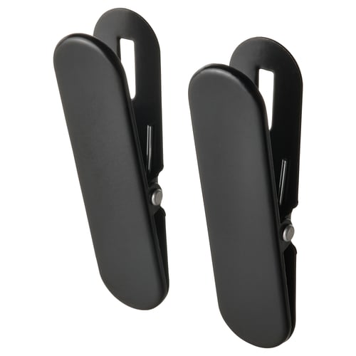 Black SKÅDIS spring clips, pairs, plastic, open design.