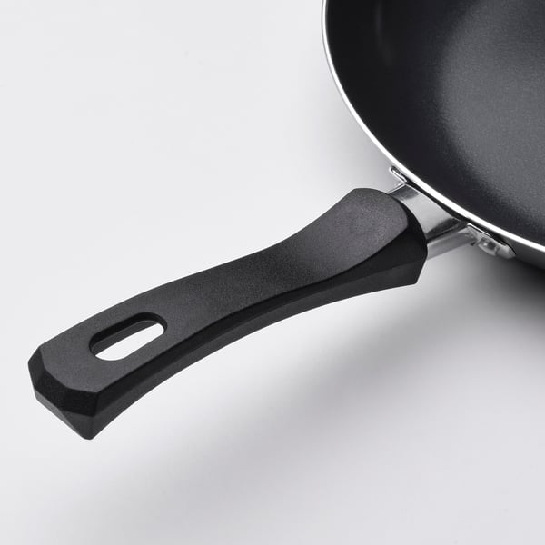 Non-stick frying pan with ergonomic handle for even heat distribution and secure grip.