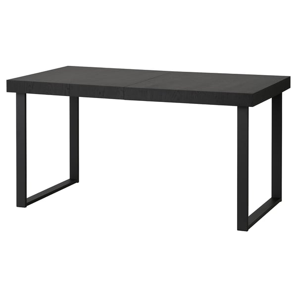 A TARSELE black extendable dining table with metal legs, featuring a sleek, industrial design.