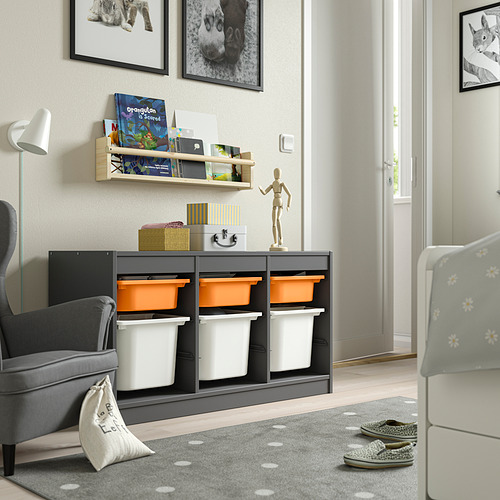 TROFAST grey unit with orange/white bins, toys, books, figure, photos, under large window