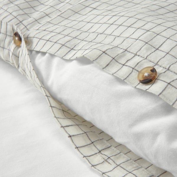 Chequered duvet cover with button closure, showing soft pre-washed cotton/linen fabric.