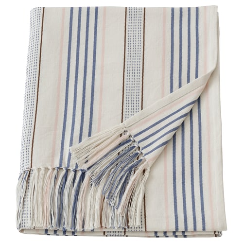 A white and blue striped cotton throw blanket with fringe at the ends, handwoven by social entrepreneurs in india.