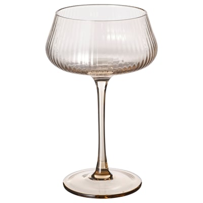 A tall, clear glass champagne coupe with a wide bowl and long stem. The design is elegant and sophisticated, ideal for serving champagne.