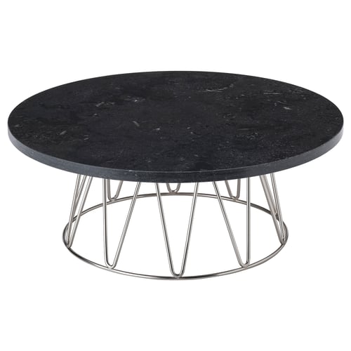 Round black marble top cake stand. Four chrome metal legs with v-shaped supports. Modern and sleek design.