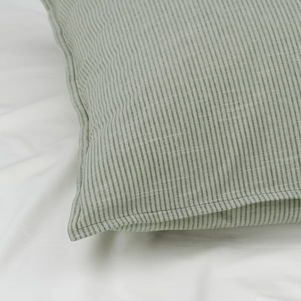 Close-up of striped green BERGPALM pillowcase, showcasing its soft, breathable cotton texture and neat stitching.