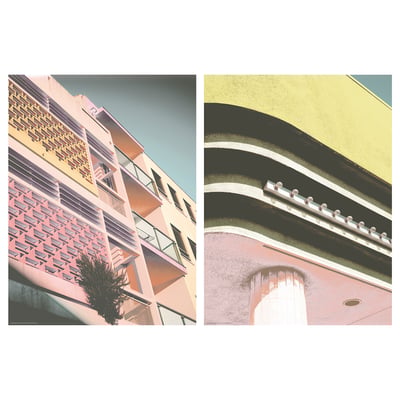 Pink and yellow buildings with pastel facades and geometric designs, one rounded corner.
